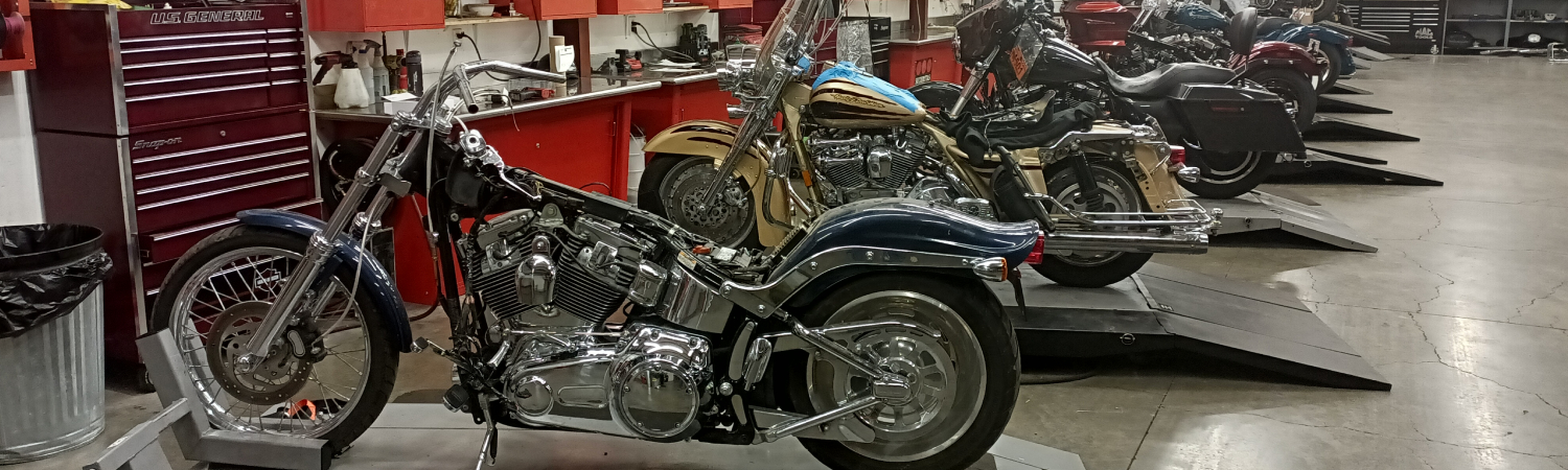 Multiple motorcycles in the Willamette Valley H-D® service department repair shop